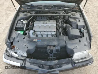 1999 Cadillac Eldorado Touring z VIN 1G6ET1298XU602343, wystawiony jako Copart lot #44327195 z przebiegiem 52 327 mil mil oraz Szkody całkowita. Historia ofert i sprzedaży dostępna na DreamBid. Obrazek 11.