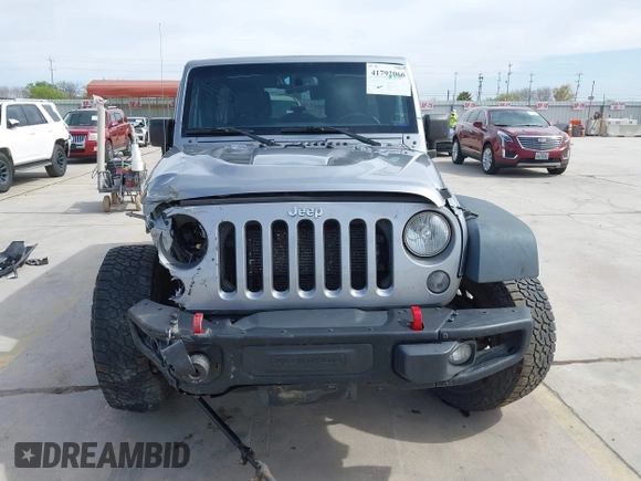 2015 Jeep Wrangler Unlimited Rubicon Hard Rock с VIN 1C4HJWFG6FL762537, выставлен на аукционе IAAI как лот 41792066 с пробегом 125 829 миль миль и . История ставок и продаж доступна на DreamBid. Изображение 12.