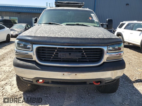 1999 GMC Sierra 1500 SLE z VIN 2GTEK19T8X1512607, wystawiony jako Copart lot #58053205 z przebiegiem 170 792 mil mil oraz Szkoda całkowita • Salvage title. Historia ofert i sprzedaży dostępna na DreamBid. Obrazek 5.
