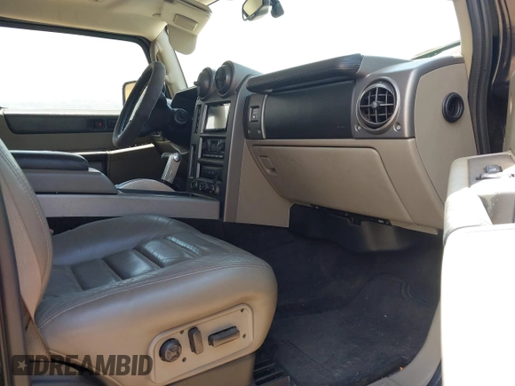 2003 Hummer H2 with VIN 5GRGN23U73H122756, listed as a IAAI auction lot 42194176 with 239,411 mi miles. Bid and sale history available at carsss.com. Image 5.