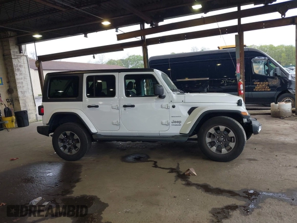 2018 Jeep Wrangler Unlimited Sahara with VIN 1C4HJXEG3JW116404, listed as a IAAI auction lot 42152506 with 57,727 mi miles and . Bid and sale history available at DreamBid. Image 13.