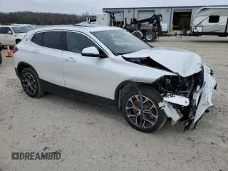 2023 BMW X2 sDrive28i with VIN WBXYH9C07P5V63719, listed as a Copart auction lot 87309194 with 43,124 mi miles and Salvage Title. Bid and sale history available at carsss.com. Image 4.