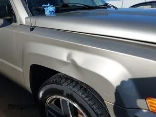 2009 Jeep Patriot Sport with VIN 1J4FT28B59D195435, listed as a IAAI auction lot 40758450 with 130,728 mi miles. Bid and sale history available at carsss.com. Image 6.