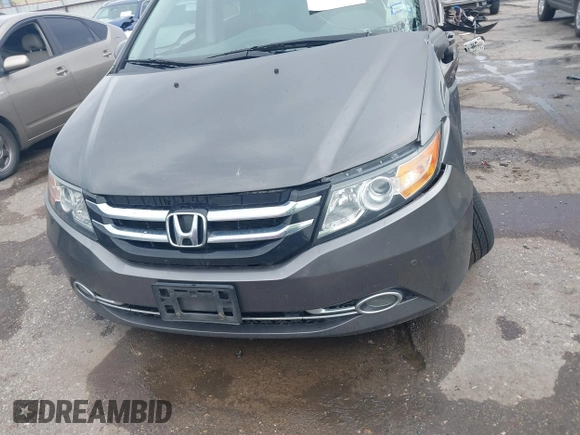 2016 Honda Odyssey Touring Elite with VIN 5FNRL5H97GB010048, listed as a IAAI auction lot 40212711 with 119,009 mi miles and . Bid and sale history available at DreamBid. Image 12.