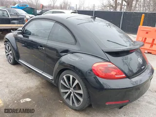 2012 Volkswagen Beetle 2.0T Turbo PZEV with VIN 3VWVA7AT1CM635697, listed as a IAAI auction lot 41552112 with 150,689 mi miles. Bid and sale history available at carsss.com. Image 2.