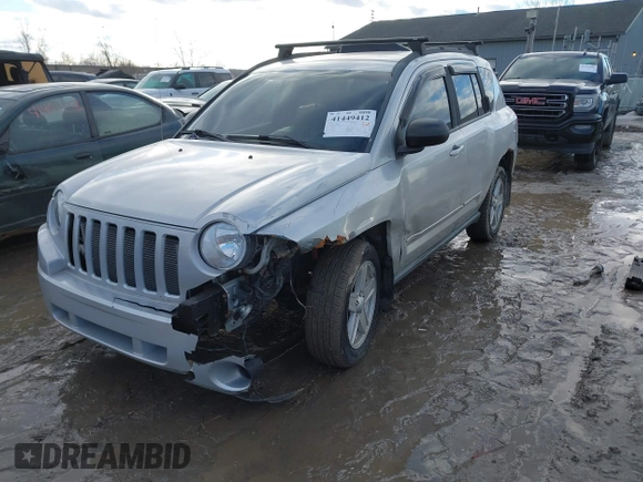 2010 Jeep Compass Sport with VIN 1J4NF4FB3AD589361, listed as a IAAI auction lot 41449412 with 127,807 mi miles. Bid and sale history available at carsss.com. Image 2.