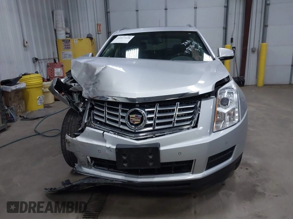 2014 Cadillac SRX Luxury Collection z VIN 3GYFNEE36ES679505, wystawiony jako IAAI lot #41817608 z przebiegiem 62 351 mil mil oraz . Historia ofert i sprzedaży dostępna na DreamBid. Obrazek 12.