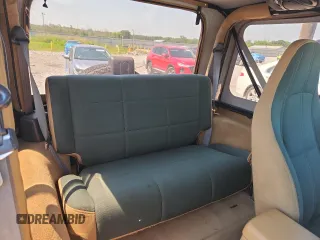 1997 Jeep Wrangler Sahara with VIN 1J4FY49S3VP519387, listed as a Copart auction lot 63822395 with 187,884 mi miles and Salvage title. Bid and sale history available at DreamBid. Image 11.