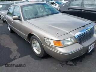 2001 Mercury Grand Marquis LS z VIN 2MEFM75W11X610723, wystawiony jako IAAI lot #42208567 z przebiegiem 190 397 mil mil oraz . Historia ofert i sprzedaży dostępna na DreamBid. Obrazek 1.