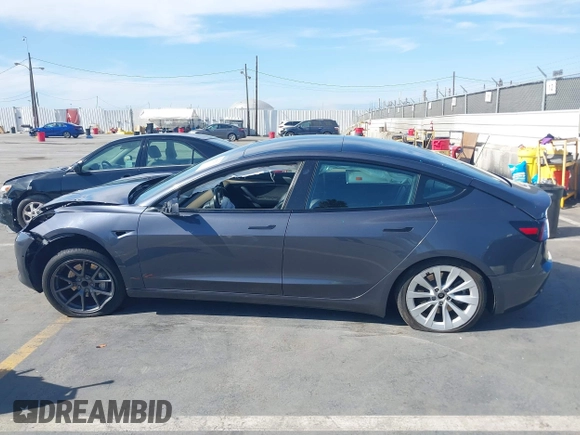 2022 Tesla Model 3 with VIN 5YJ3E1EA1NF142713, listed as a IAAI auction lot 42027630 with 112,557 mi miles. Bid and sale history available at carsss.com. Image 13.