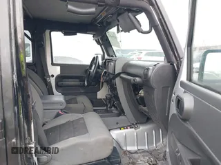 2008 Jeep Wrangler Unlimited X with VIN 1J8GA39148L577903, listed as a IAAI auction lot 41564957 with 95,359 mi miles. Bid and sale history available at carsss.com. Image 5.
