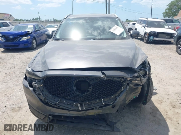 2017 Mazda CX-5 Grand Touring with VIN JM3KFADL3H0227655, listed as a IAAI auction lot 41897981 with 103,545 mi miles. Bid and sale history available at carsss.com. Image 12.