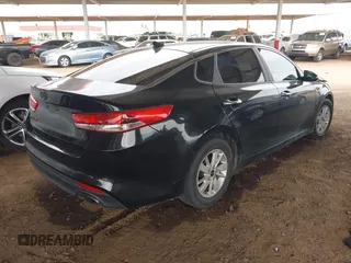 2016 Kia Optima LX with VIN KNAGT4L32G5111503, listed as a IAAI auction lot 42011975 with 114,476 mi miles. Bid and sale history available at carsss.com. Image 4.