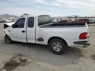 1999 Ford F-150 XL with VIN 1FTZX0721XKA49751, listed as a Copart auction lot 52429195 with Not provided miles and Salvage title. Bid and sale history available at DreamBid. Image 2.