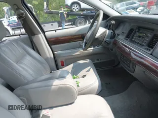 2004 Mercury Grand Marquis LS Premium z VIN 2MEFM75W04X634791, wystawiony jako IAAI lot #42482387 z przebiegiem 133 145 mil mil oraz . Historia ofert i sprzedaży dostępna na DreamBid. Obrazek 5.