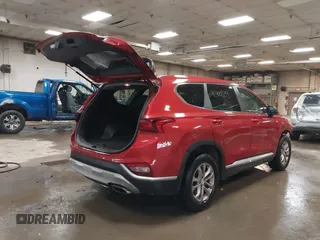 2019 Hyundai Santa Fe SE z VIN 5NMS2CAD3KH125454, wystawiony jako IAAI lot #42400534 z przebiegiem 75 155 mil mil oraz . Historia ofert i sprzedaży dostępna na DreamBid. Obrazek 4.