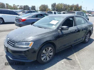 2015 Volkswagen Jetta SE z VIN 3VWD07AJ1FM284890, wystawiony jako IAAI lot #42328592 z przebiegiem 92 880 mil mil oraz . Historia ofert i sprzedaży dostępna na DreamBid. Obrazek 2.