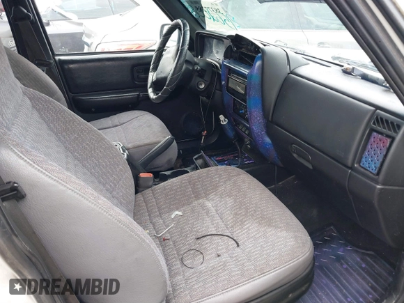 1998 Jeep Cherokee Sport with VIN 1J4FT68S5WL199283, listed as a IAAI auction lot 38377285 with 208,074 mi miles. Bid and sale history available at carsss.com. Image 5.