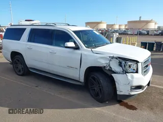 2015 GMC Yukon XL SLT with VIN 1GKS1HKC2FR612690, listed as a IAAI auction lot 41234188 with 113,830 mi miles. Bid and sale history available at carsss.com. Image 1.