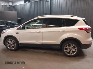 2016 Ford Escape Titanium with VIN 1FMCU9J94GUB02810, listed as a IAAI auction lot 41643907 with 119,684 mi miles. Bid and sale history available at carsss.com. Image 13.