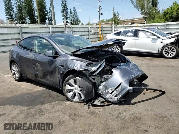 2023 Tesla Model Y Long Range with VIN 7SAYGDEE9PF885405, listed as a Copart auction lot 52858105 with 23,424 mi miles and Non Repairable. Bid and sale history available at DreamBid. Image 11.