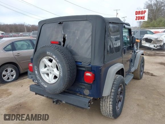 2005 Jeep Wrangler Sport with VIN 1J4FA49S05P384308, listed as a IAAI auction lot 41821354 with 106,394 mi miles. Bid and sale history available at carsss.com. Image 4.
