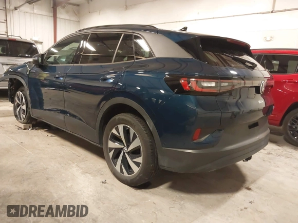 2023 Volkswagen ID.4 Pro z VIN 1V2DNPE84PC038042, wystawiony jako IAAI lot #41446269 z przebiegiem 12 878 mil mil oraz . Historia ofert i sprzedaży dostępna na DreamBid. Obrazek 3.
