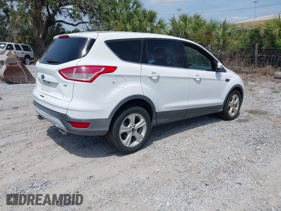 2015 Ford Escape SE with VIN 1FMCU0G74FUB88670, listed as a IAAI auction lot 42115919 with 129,969 mi miles. Bid and sale history available at carsss.com. Image 4.