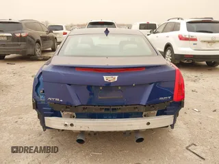 2015 Cadillac ATS Luxury AWD z VIN 1G6AH1RX6F0120173, wystawiony jako IAAI lot #41701867 z przebiegiem 70 142 mil mil oraz . Historia ofert i sprzedaży dostępna na DreamBid. Obrazek 16.