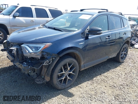 2018 Toyota RAV4 Hybrid SE with VIN JTMJJREV9JD191552, listed as a IAAI auction lot 42158665 with 84,025 mi miles and . Bid and sale history available at DreamBid. Image 2.