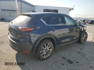2021 Mazda CX-5 Grand Touring with VIN JM3KFADM7M0385788, listed as a Copart auction lot 88065255 with 27,787 mi miles and Salvage Title. Bid and sale history available at carsss.com. Image 3.