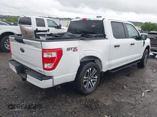 2023 Ford F-150 XL with VIN 1FTEW1EP5PFB87582, listed as a IAAI auction lot 42254015 with 10,476 mi miles and . Bid and sale history available at DreamBid. Image 4.