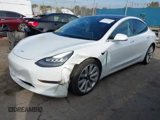 2020 Tesla Model 3 Long Range with VIN 5YJ3E1EB9LF620771, listed as a IAAI auction lot 41795008 with 53,155 mi miles and . Bid and sale history available at DreamBid. Image 2.