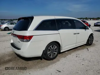 2014 Honda Odyssey Touring with VIN 5FNRL5H98EB059790, listed as a Copart auction lot 50547555 with Not Provided miles and Salvage Title. Bid and sale history available at DreamBid. Image 3.