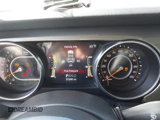 2023 Jeep Wrangler Sahara with VIN 1C4HJXEN5PW702268, listed as a IAAI auction lot 42288704 with 57,240 mi miles and . Bid and sale history available at DreamBid. Image 7.