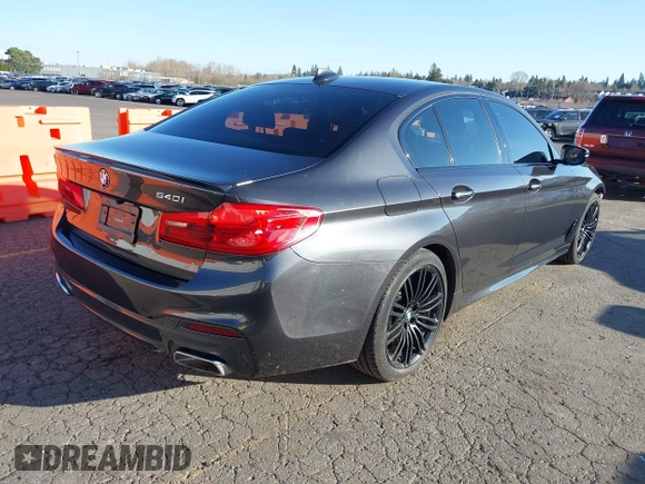 2018 BMW 5 Series 540i with VIN WBAJE5C58JG918692, listed as a IAAI auction lot 41665415 with 61,261 mi miles and . Bid and sale history available at carsss.com. Image 4.