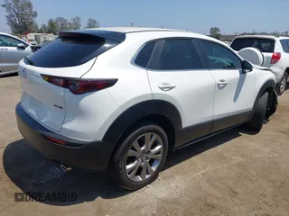 2021 Mazda CX-30 Select with VIN 3MVDMBBL9MM313039, listed as a IAAI auction lot 42575424 with 21,083 mi miles and . Bid and sale history available at DreamBid. Image 4.
