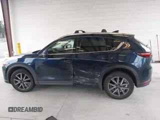 2018 Mazda CX-5 Grand Touring with VIN JM3KFBDM4J0302870, listed as a IAAI auction lot 41934217 with 57,151 mi miles. Bid and sale history available at carsss.com. Image 15.