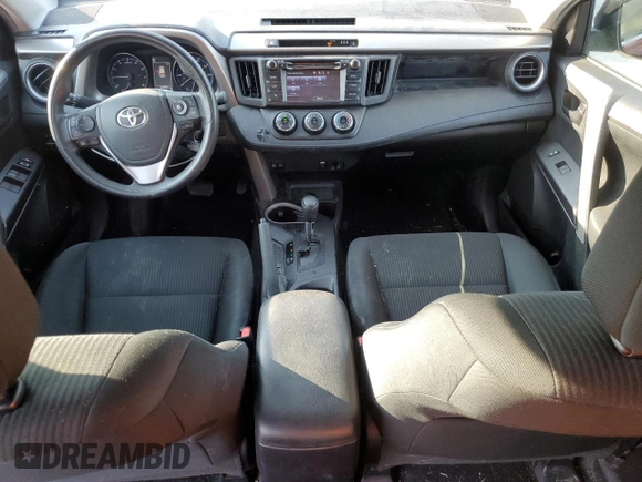 2018 Toyota RAV4 LE with VIN 2T3BFREV7JW723938, listed as a Copart auction lot 62814195 with 107,051 mi miles and Salvage title. Bid and sale history available at DreamBid. Image 8.
