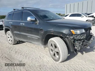 2015 Jeep Grand Cherokee Overland with VIN 1C4RJFCG6FC919637, listed as a Copart auction lot 52072925 with 111,552 mi miles and Salvage Title. Bid and sale history available at carsss.com. Image 4.
