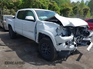 2021 Toyota Tacoma SR z VIN 5TFCZ5AN5MX265181, wystawiony jako IAAI lot #42077902 z przebiegiem 102 192 mil mil oraz . Historia ofert i sprzedaży dostępna na DreamBid. Obrazek 1.