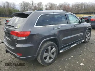 2015 Jeep Grand Cherokee Overland with VIN 1C4RJFCG0FC848046, listed as a Copart auction lot 49514795 with 212,688 mi miles and Clean title. Bid and sale history available at DreamBid. Image 3.