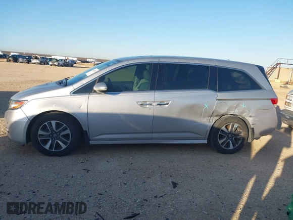 2014 Honda Odyssey Touring with VIN 5FNRL5H97EB094353, listed as a IAAI auction lot 41701712 with 141,228 mi miles and . Bid and sale history available at DreamBid. Image 15.