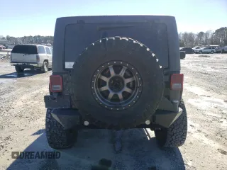 2016 Jeep Wrangler Unlimited Rubicon Hard Rock with VIN 1C4BJWFG9GL209484, listed as a Copart auction lot 87815475 with 85,729 mi miles and Salvage Title. Bid and sale history available at carsss.com. Image 6.
