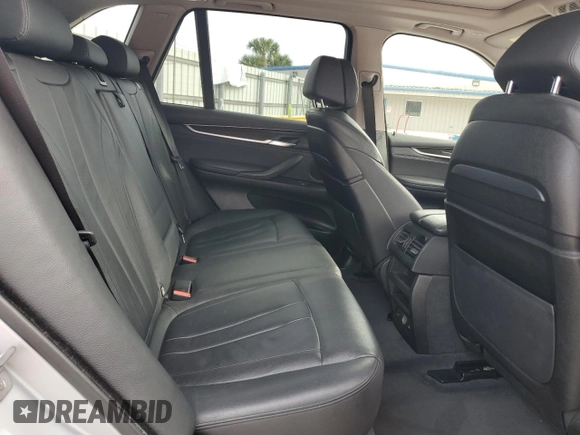 2015 BMW X5 xDrive50i with VIN 5UXKR6C51F0J74160, listed as a Copart auction lot 79337044 with 143,436 mi miles and Salvage title. Bid and sale history available at DreamBid. Image 12.