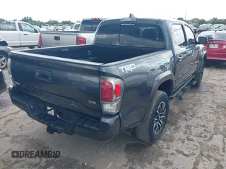 2022 Toyota Tacoma SR5 with VIN 3TMAZ5CN6NM186713, listed as a IAAI auction lot 42607719 with 60,704 mi miles and . Bid and sale history available at DreamBid. Image 4.