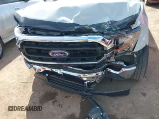 2023 Ford F-150 XL with VIN 1FTMF1C53PKF34184, listed as a IAAI auction lot 42242703 with 27,312 mi miles and . Bid and sale history available at DreamBid. Image 6.