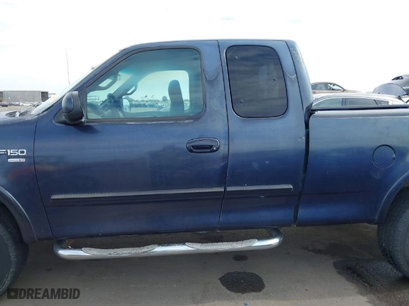 2000 Ford F-150 XL with VIN 1FTRX18L2YKA10388, listed as a IAAI auction lot 41526430 with 144,480 mi miles. Bid and sale history available at carsss.com. Image 14.