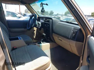 1999 Jeep Cherokee SE with VIN 1J4FF28S4XL592788, listed as a IAAI auction lot 42560002 with 189,258 mi miles and . Bid and sale history available at DreamBid. Image 5.