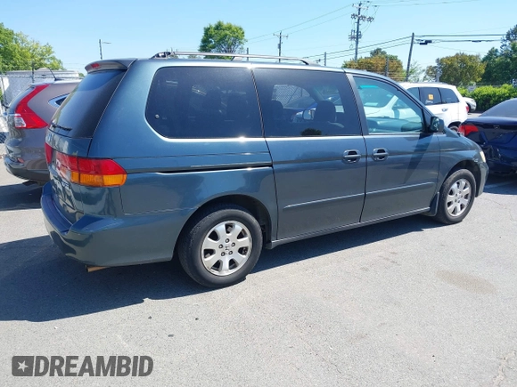 2004 Honda Odyssey EX with VIN 5FNRL18684B027564, listed as a IAAI auction lot 42044126 with 185,627 mi miles and . Bid and sale history available at DreamBid. Image 4.